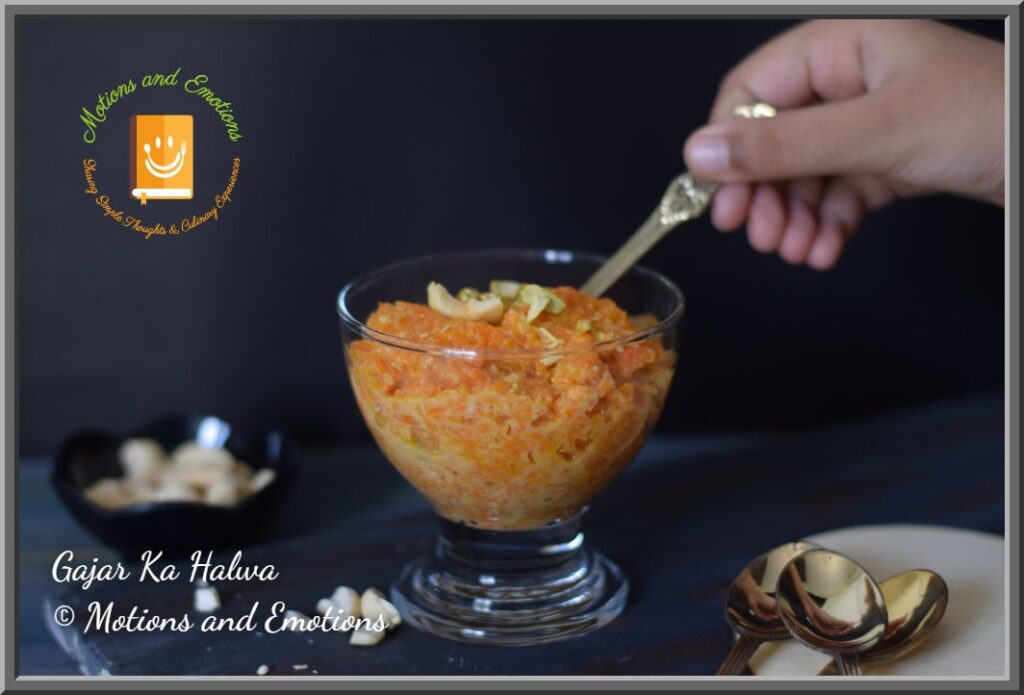Digging Gajar ka halwa with a golden spoon from a dessert bowl  Side view