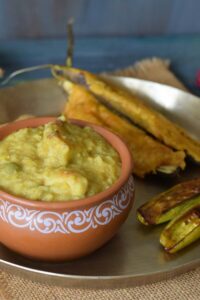 khichuri in an earthen pot along with vegetable fries