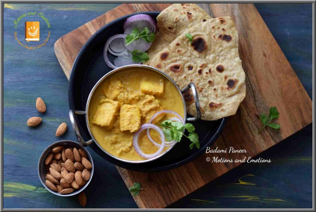 Badami paneer served in a small wok along with paratha