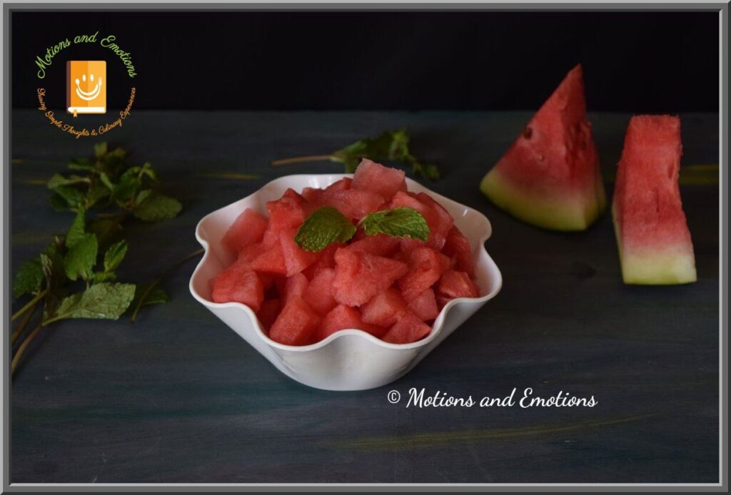 Watermelon cubes in a bowl along with mint sprigs