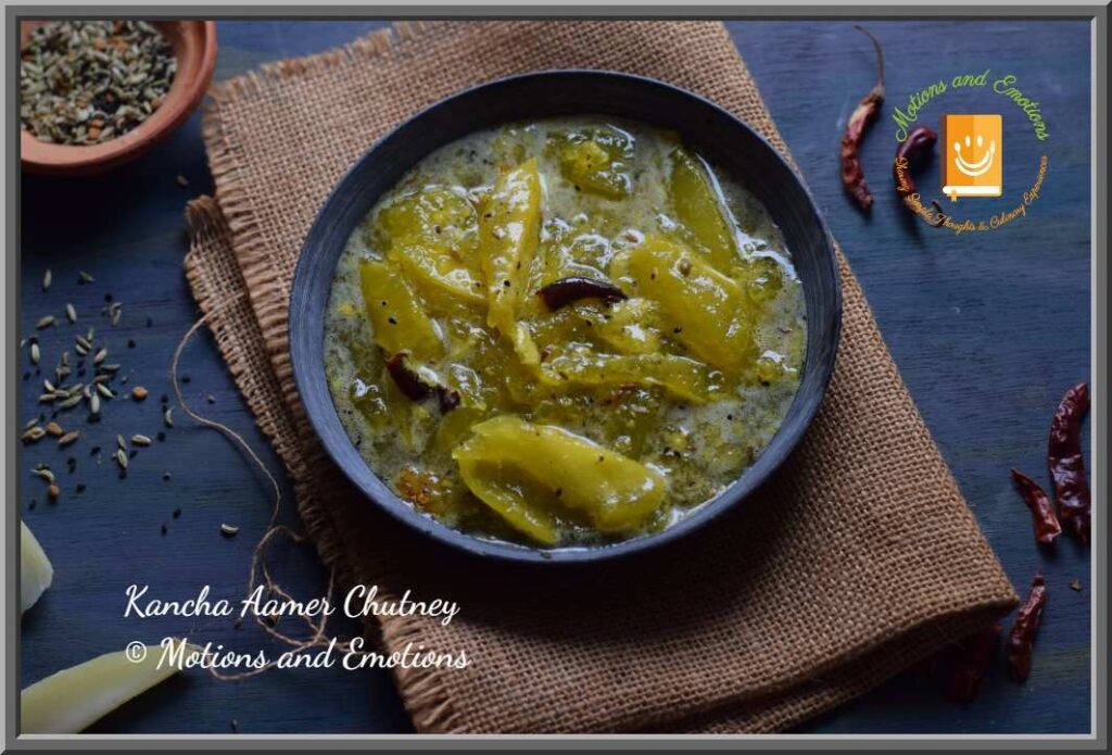 Mango chutney served in a black stoneware dish along with spices