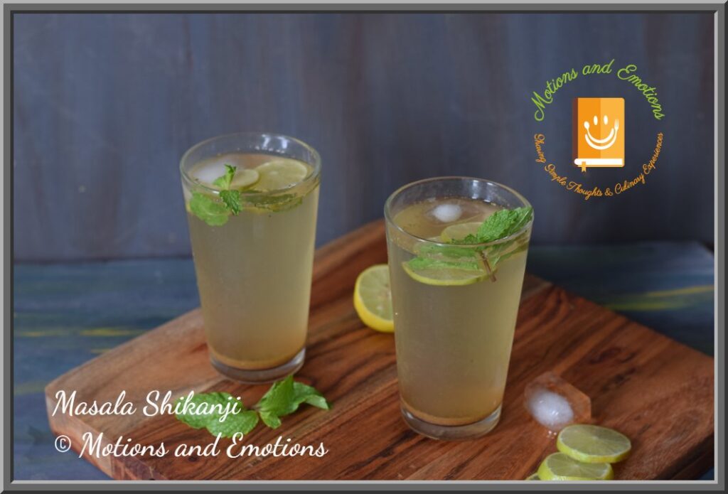 Masala Shikanji served in two glass along with ice cubes, mint and lemon
