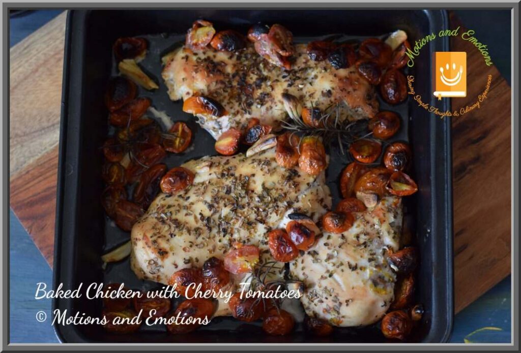 Baked chicken breasts in a black baking tray