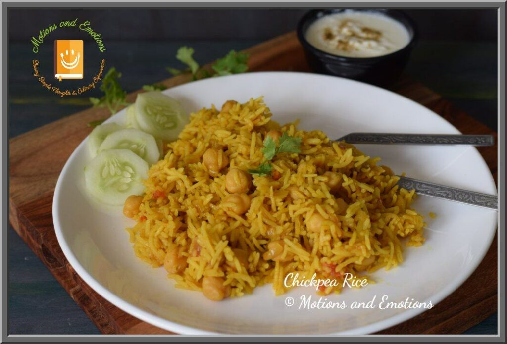 chana pulao served in a white plate along with cucumber