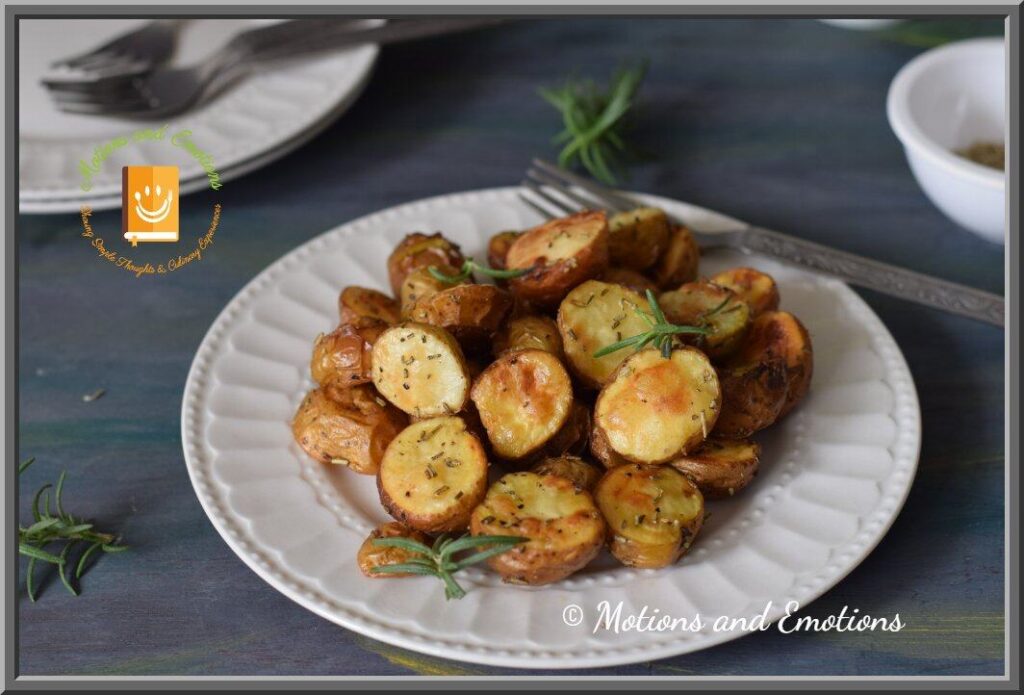 oven roasted crispy small potatoes served on a white half plate
