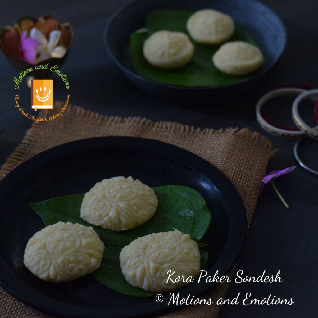 sondesh served on black plate covered with betel leaf