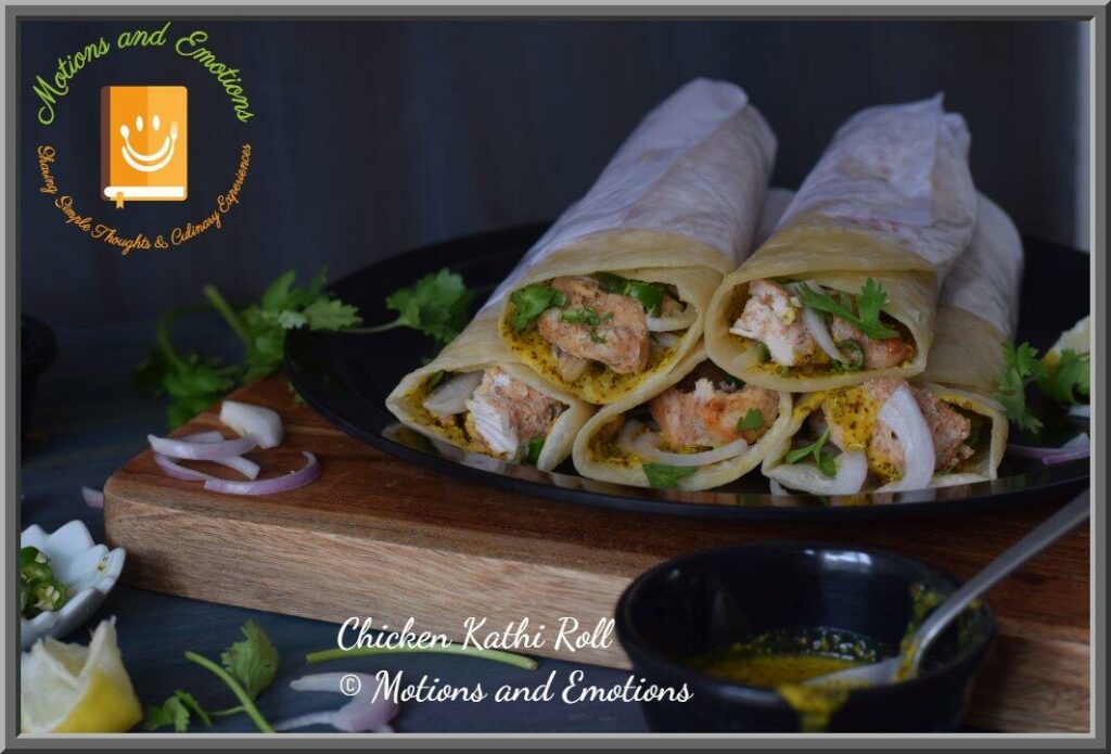 Chicken kathi roll stacked on a plate front view