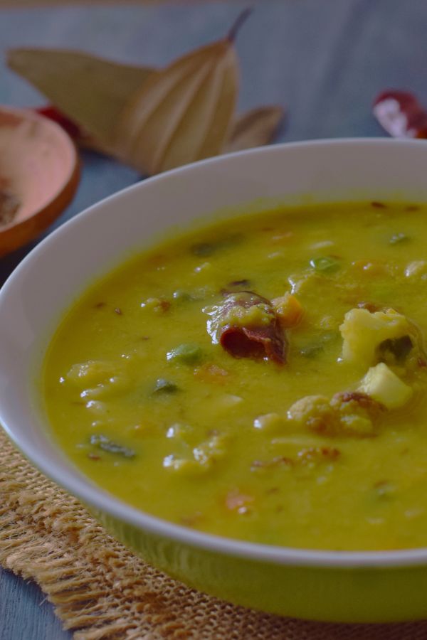 bowl full of yellow dal with vegetables