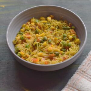 vegetable maggi in a grey bowl