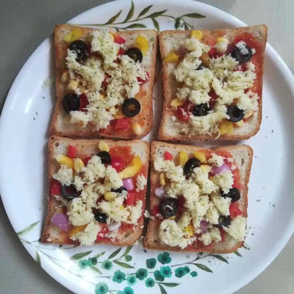 bread slices topped with vegetables and cheese