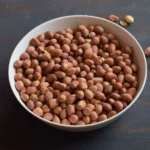a bowl full of roasted peanuts