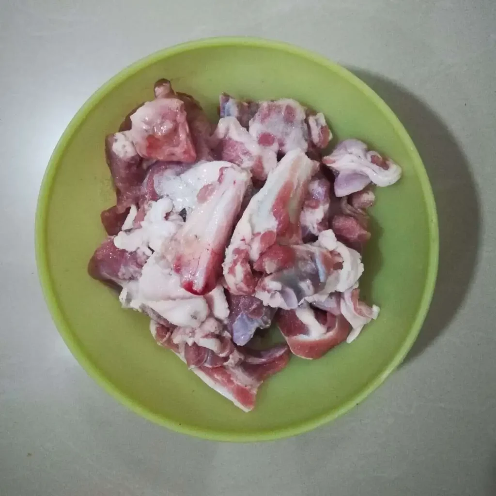 mutton pieces in a yellow bowl