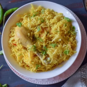 chicken pulao in a white bowl; top view