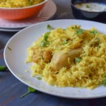 chicken pulao in a white plate