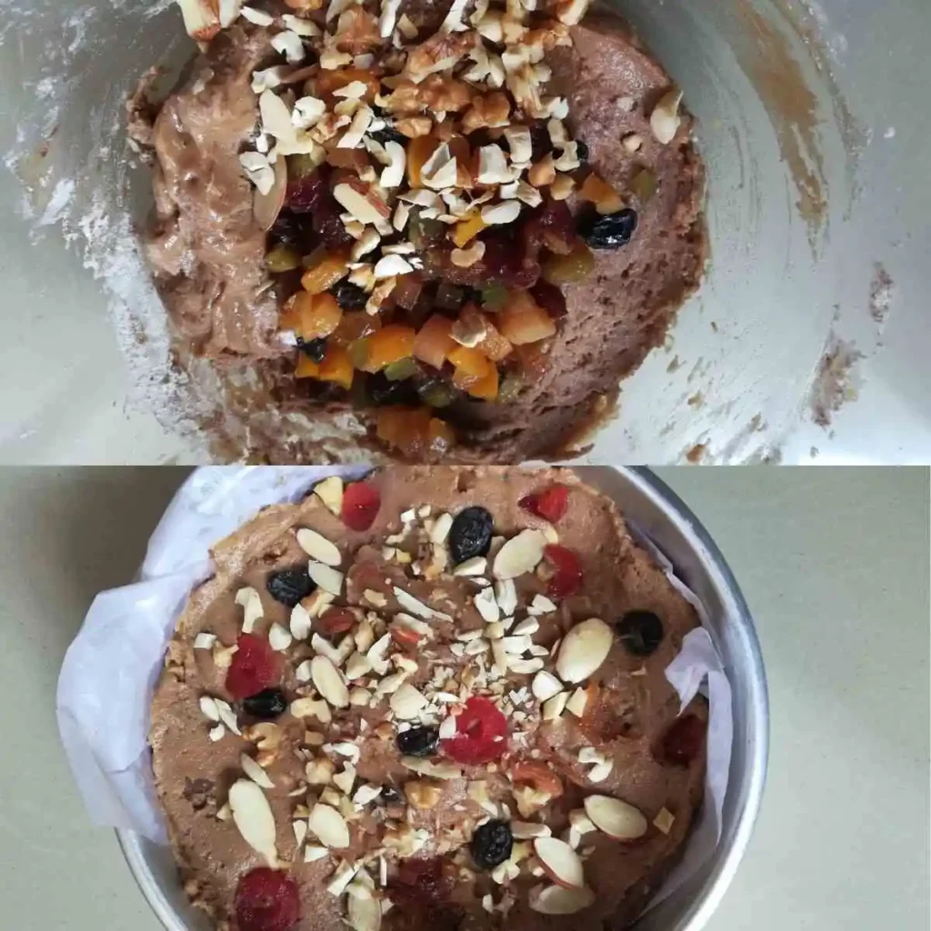 Adding soaked fruits and nuts in batter and pour batter in prepared tin