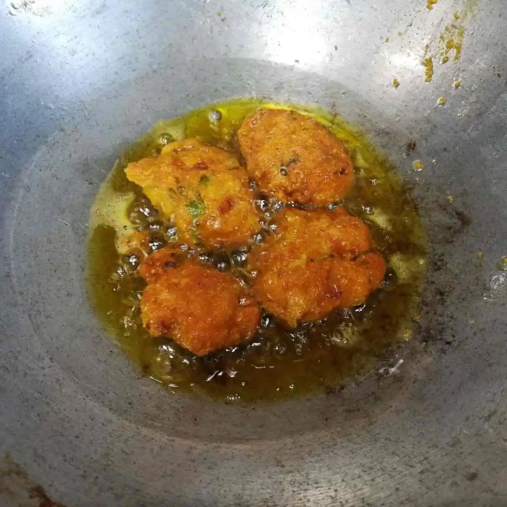 frying of fish roe fritters till golden