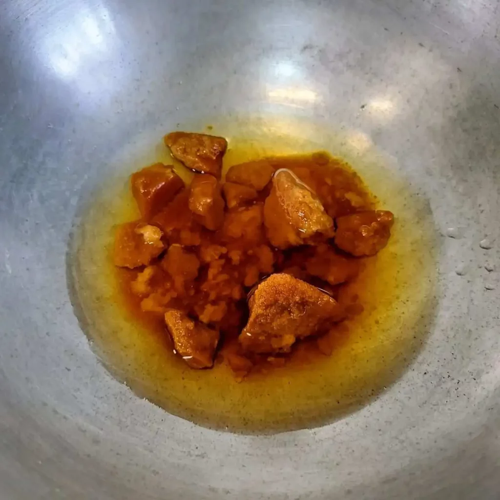 dissolving jaggery in water