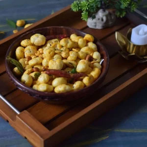 makhana chivda in a wooden bowl kept on a tray