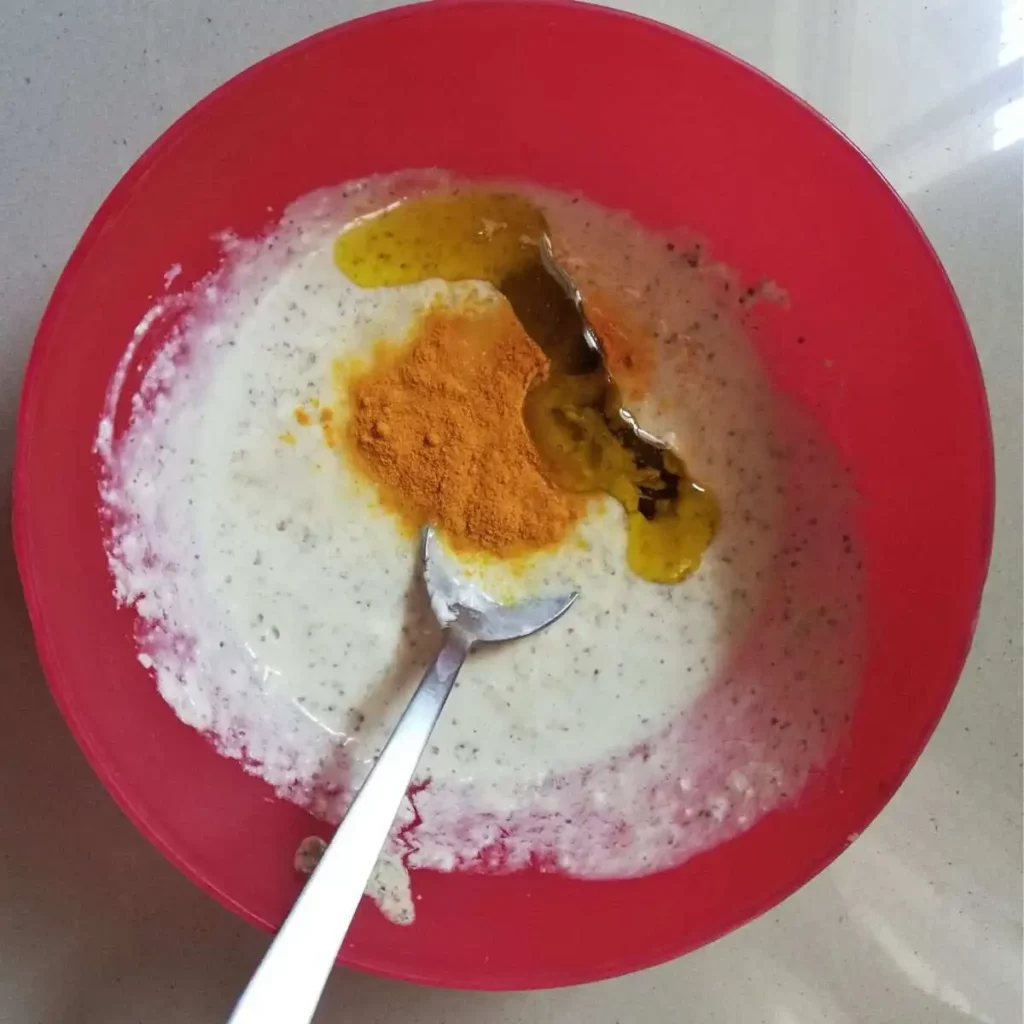 mustard paste and poppy seed paste along with turmeric powder and mustard oil
